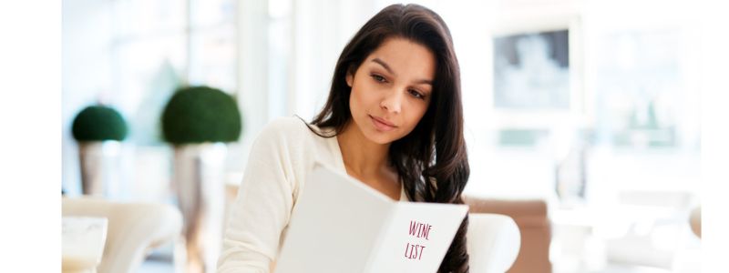 Choosing from the wine list by Wines With Attitude