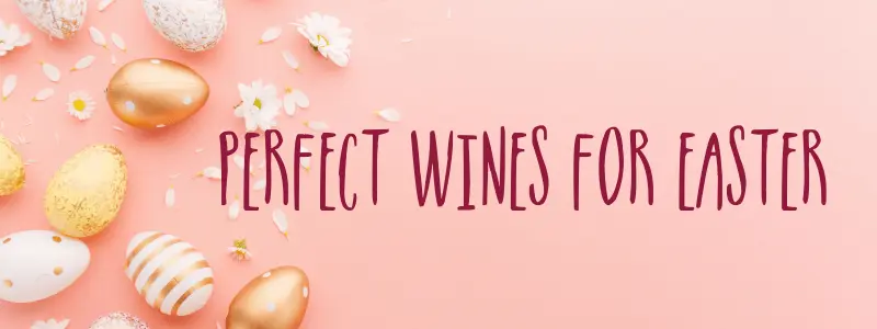 Easter eggs and spring flowers on a pink background with the caption Perfect wines for Easter