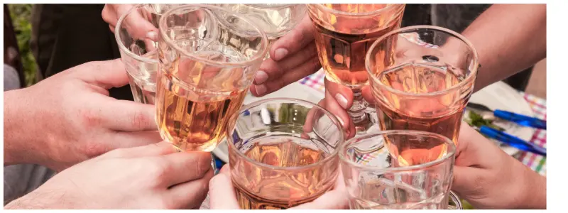 Glasses of rosé being clinked together