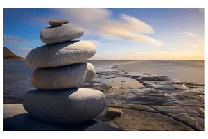Pile of stones balancing on each other on a beach