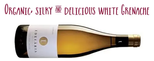 Bottle of Edetaria Seleccio Blanco wine on its side captioned Organic, silky & delicious white Grenache"