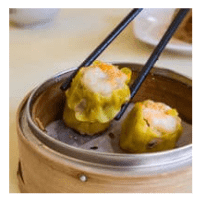 Some dim sum being picked up with chopsticks