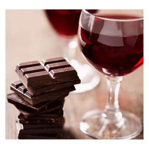 Pieces of milk and dark chocolate and a glass of red wine