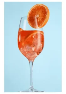 Glass of Aperol Spritz with ice and a slice of orange