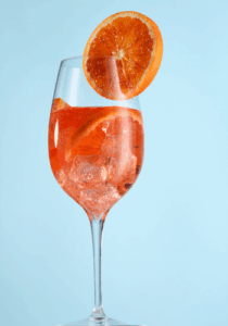 Glass of Aperol Spritz with orange slice to garnish