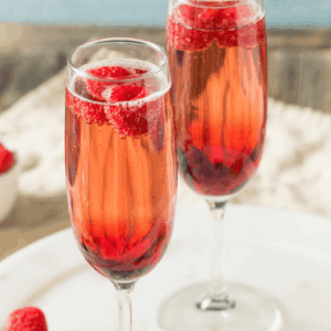 Two glasses of Kir Imperiale, sparkling wine with raspberry liqueur
