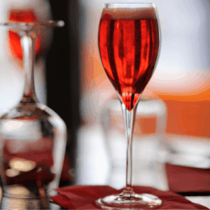 A glass of Kir Royale, sparkling wine with creme de cassis