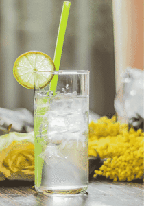 Glass of summer fizz, sparkling wine with elderflower cordial and lemon juice