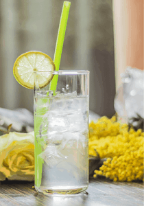 Glass of summer fizz, sparkling wine with elderflower cordial and lemon juice