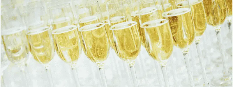 Several wine glasses filled with Cava or other sparkling wines