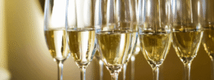 A number of glasses containing sparkling wine