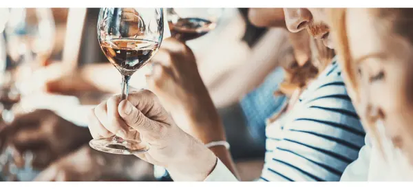 A group of people tasting wine at a tasting or trade fair