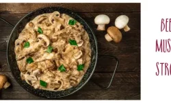 A dark-coloured bowl of beef stroganoff surrounded by some mushrooms and captioned "Best wines for Beef or Mushroom Stroganoff"