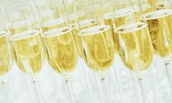 Several wine glasses filled with Cava or other sparkling wines